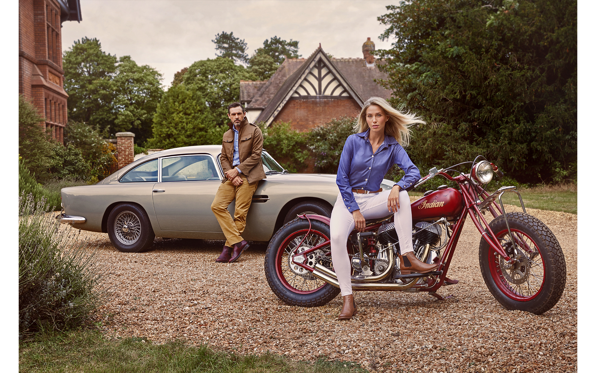  advertising fashion photo shoot for Paul brown clothing male and female model with Aston Martin classic car and classic motorbike at egerton house newmarket suffolk