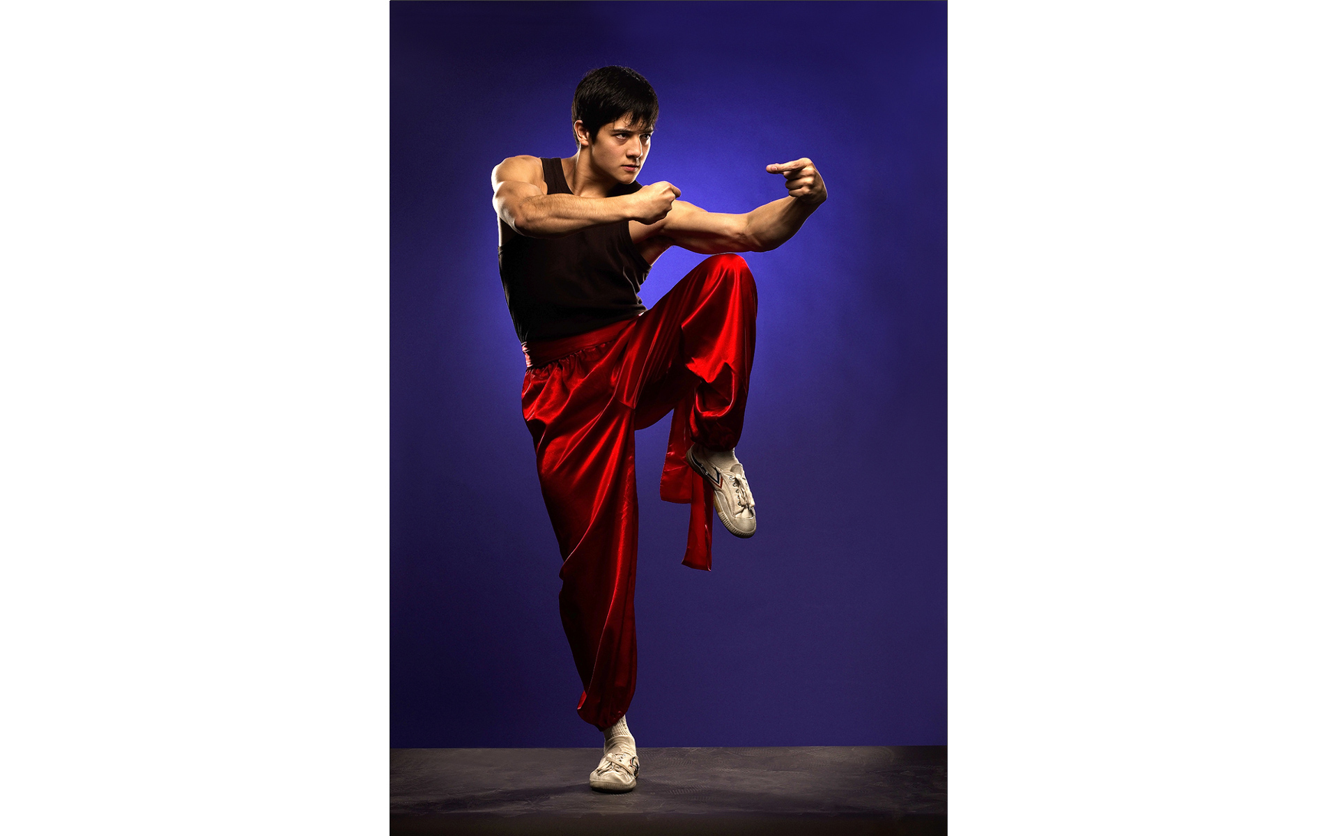 Martial artist performer in a photography studio 